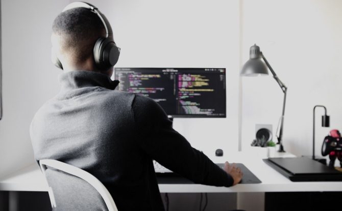 Person with headset sitting at a desk