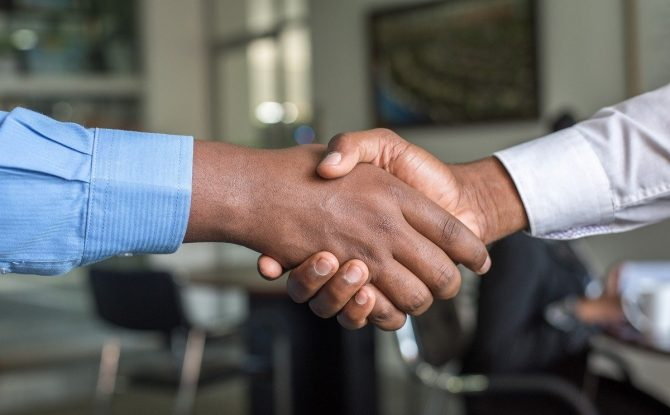 Two people shaking hands