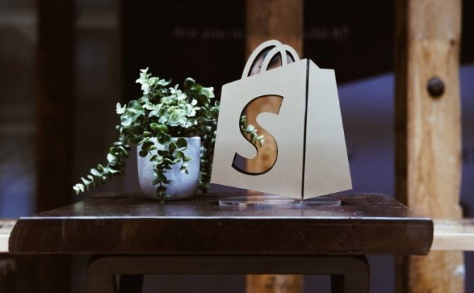 Shopify logo as a display on a table